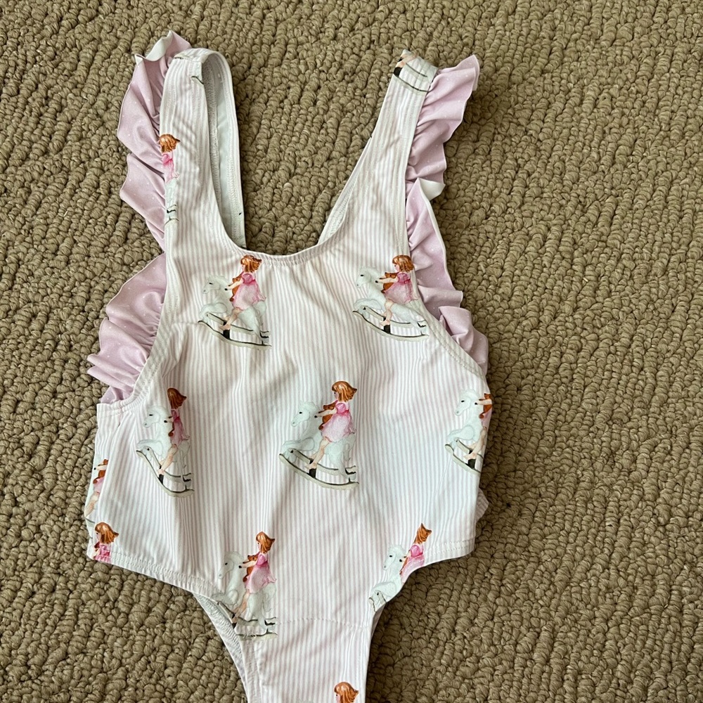 Very soft, very sweet one piece swimsuit….little girl & rocking horse ☺️!!